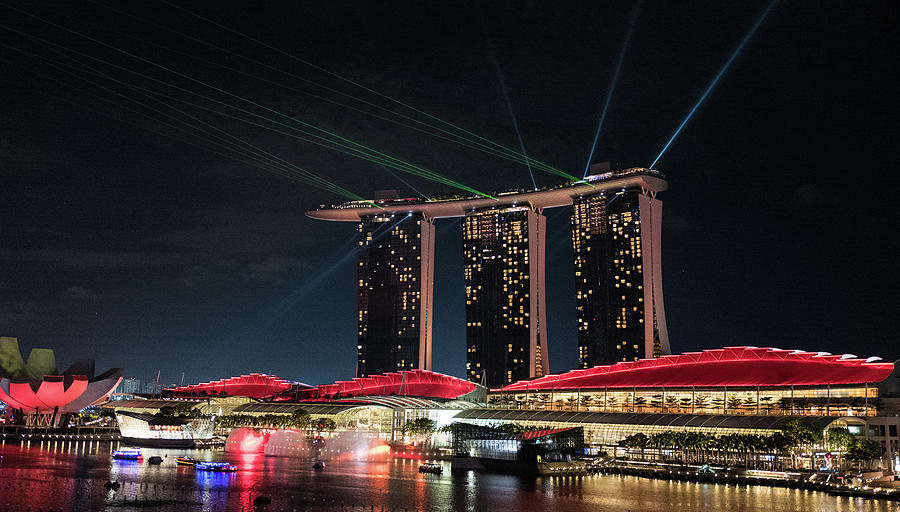 Light show on Singapore Harbour Photograph by Jocelyn Kahawai
