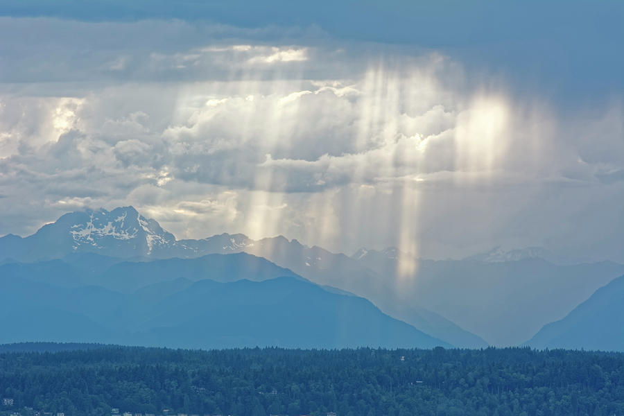 Light through clouds Photograph by Peter Ponzio