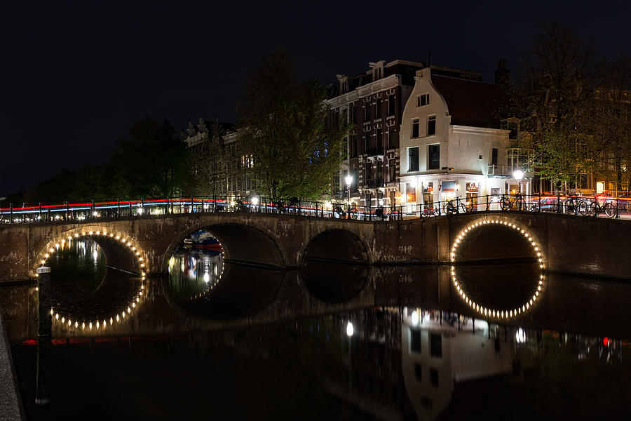 Light Trails and Circles - Reflecting on Magical Amsterdam Canals Photograph by Georgia Mizuleva