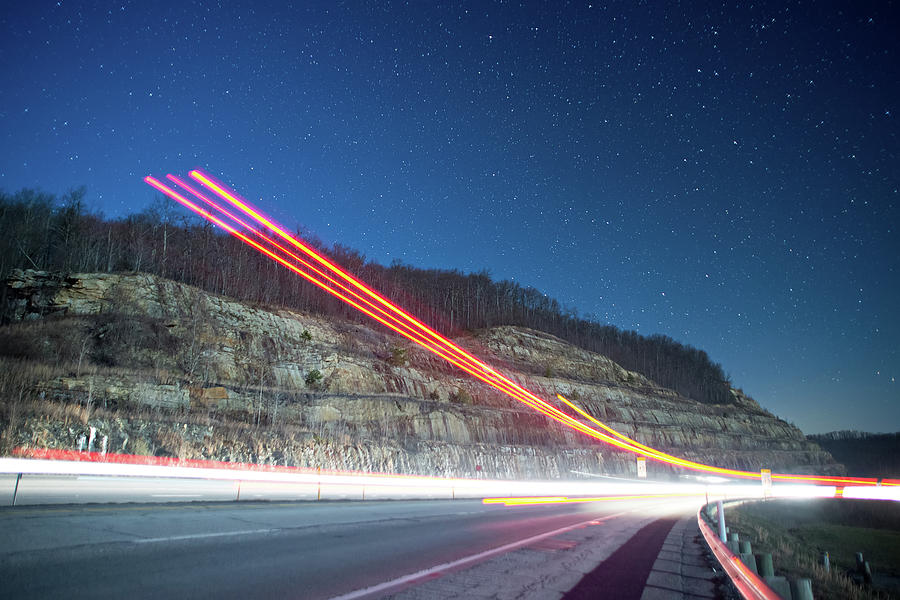 Light Trails At Night In The Mountains From Outgoing Traffic Photograph by Alex Grichenko