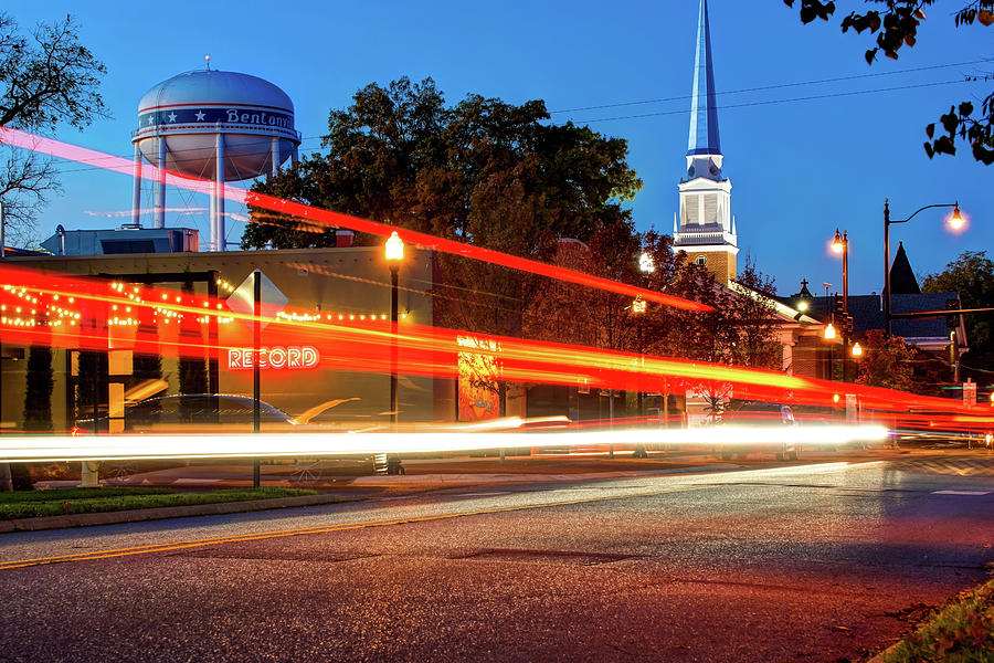 City Photograph - Light Trails In Front of Bentonville Record and Water Tower by Gregory Ballos