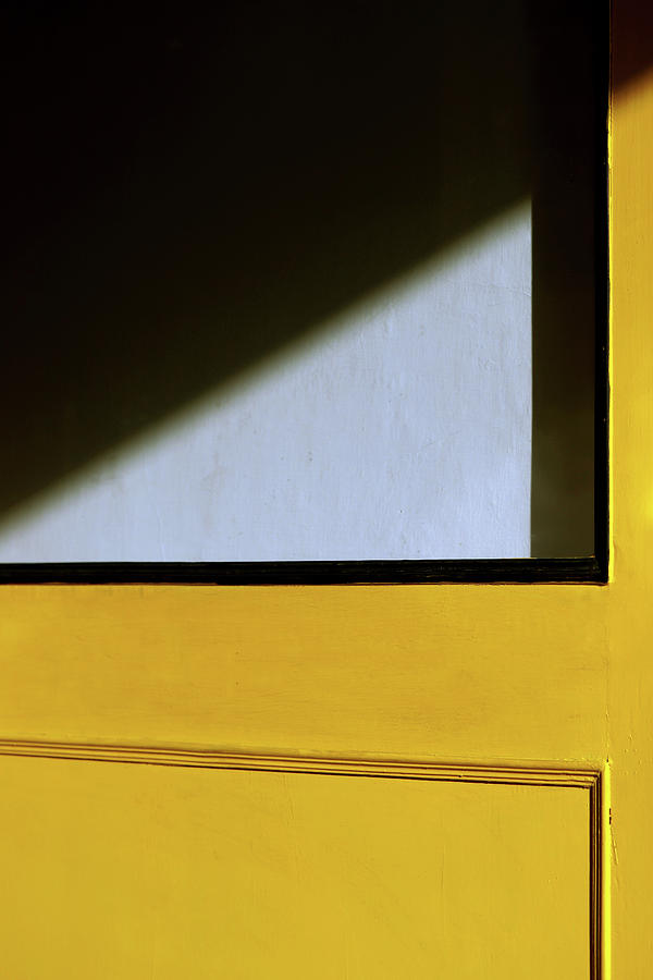 Light Triangle on Yellow Door Photograph by Prakash Ghai