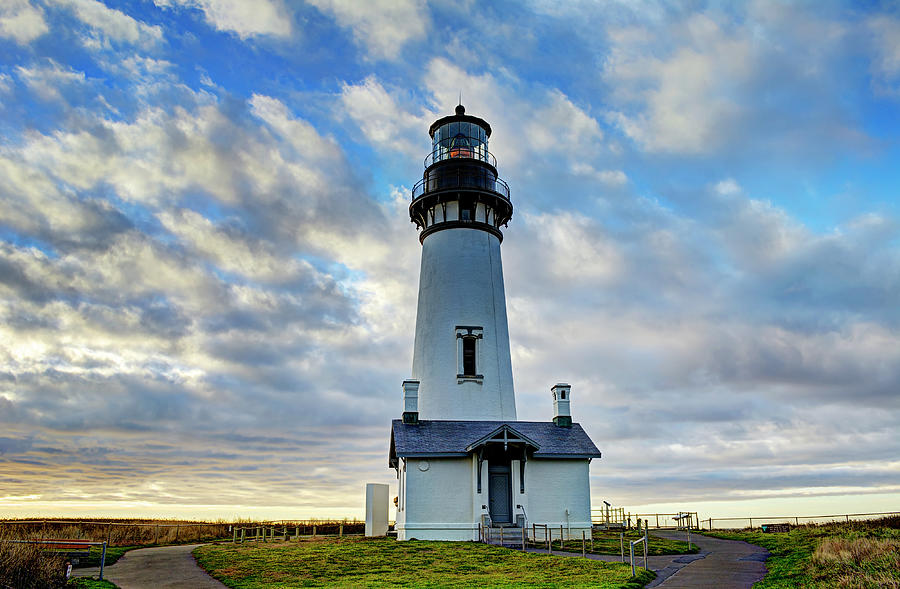 Lighthouse And Clouds by Marv Vandehey