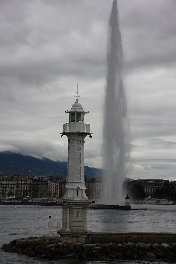 Lighthouse Photograph - Lighthouse and Fountain by Nurlan Alymbaev