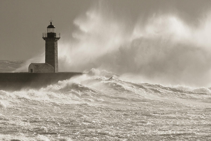 Lighthouse and giant waves Photograph by Antonio Costa