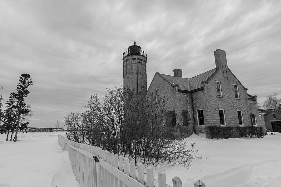 Lighthouse and Mackinac Bridge Winter Black and White  Photograph by John McGraw