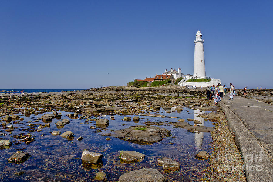 Lighthouse at low tide. Photograph by Elena Perelman