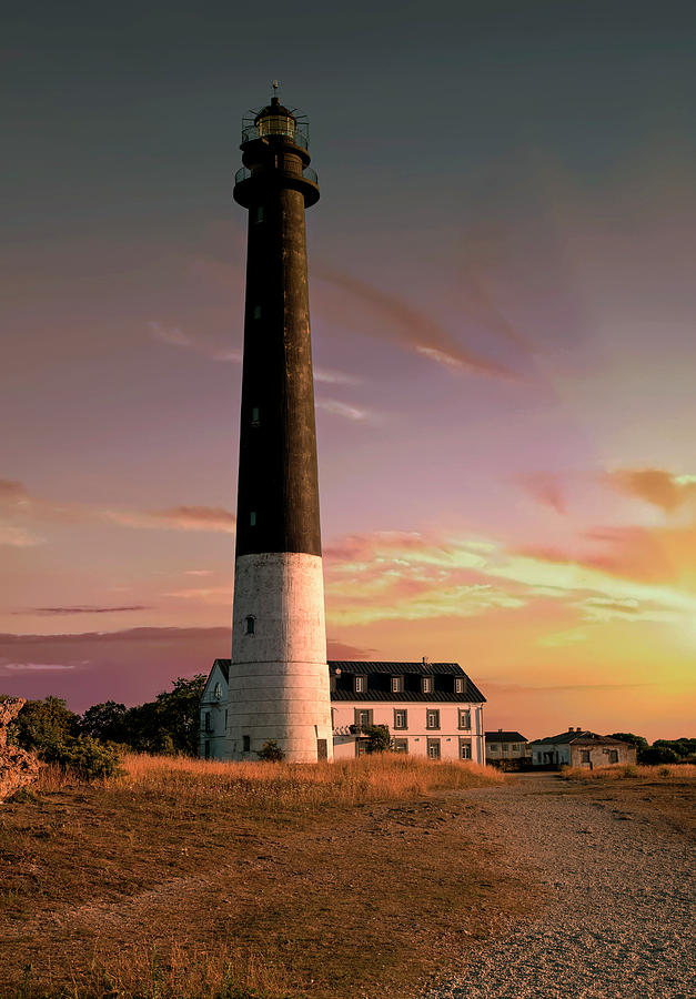 Lighthouse at the sunset Photograph by Jaroslaw Blaminsky
