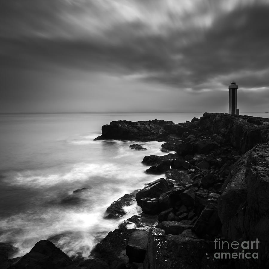 Black And White Photograph - Lighthouse By The Sea by Gunnar Orn Arnason