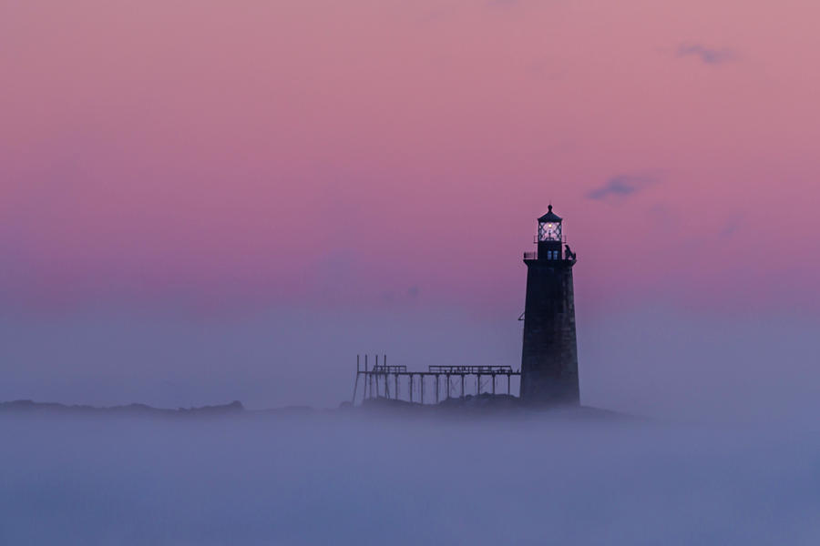 Lighthouse in the Clouds Photograph by Colin Chase
