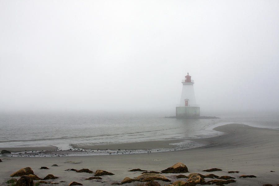 Lighthouse in the fog Photograph by Tatiana Travelways