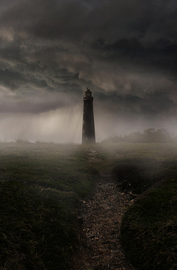 Lighthouse in the rain Photograph by Jaroslaw Blaminsky