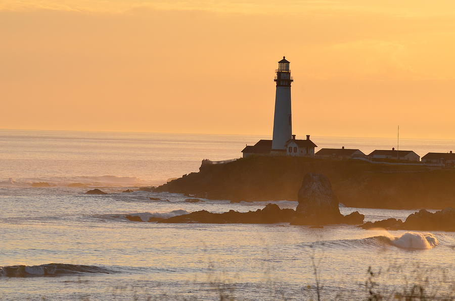 Lighthouse At Sunset Photograph by Alex King