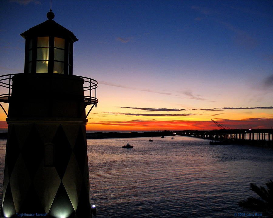 Lighthouse Sunset Photograph by Larry Beat