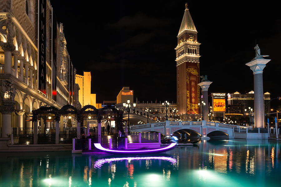 Architecture Photograph - Lighting Up the Night in Neon - Colorful Canals and Gondolas at the Venetian Las Vegas by Georgia Mizuleva