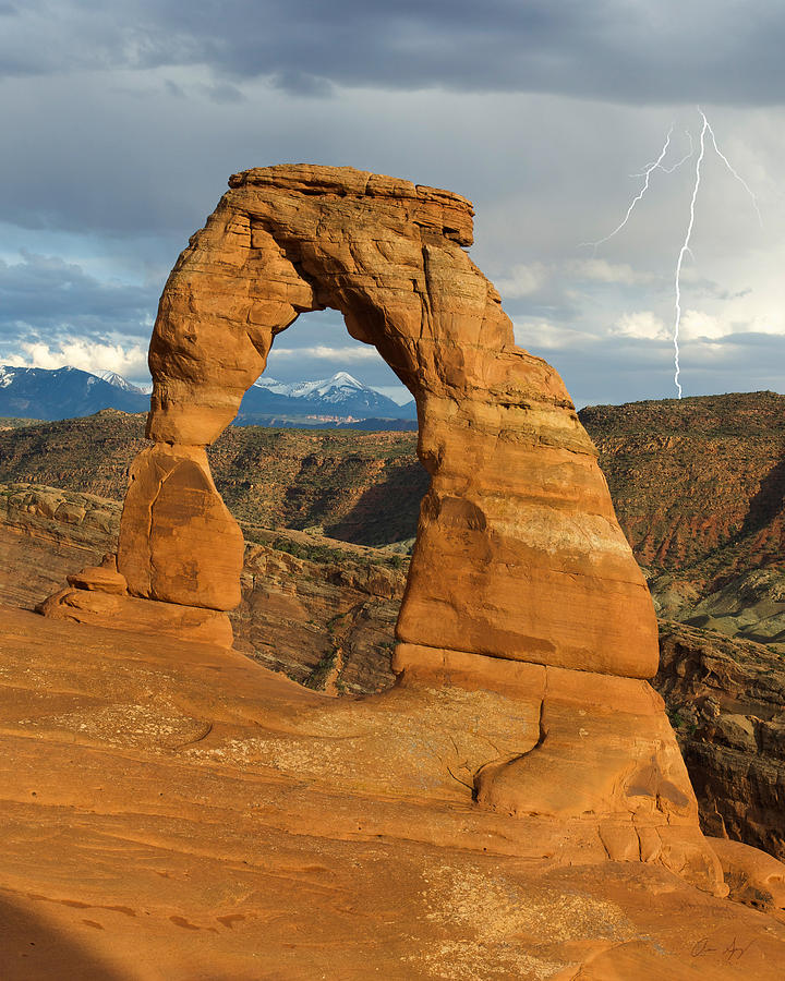 Lightning at Delicate Arch Vertical Photograph by Aaron Spong