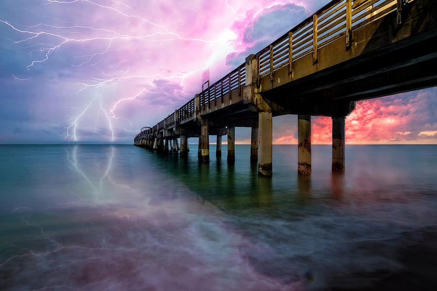 Lightning at the Pier Photograph by Debra and Dave Vanderlaan