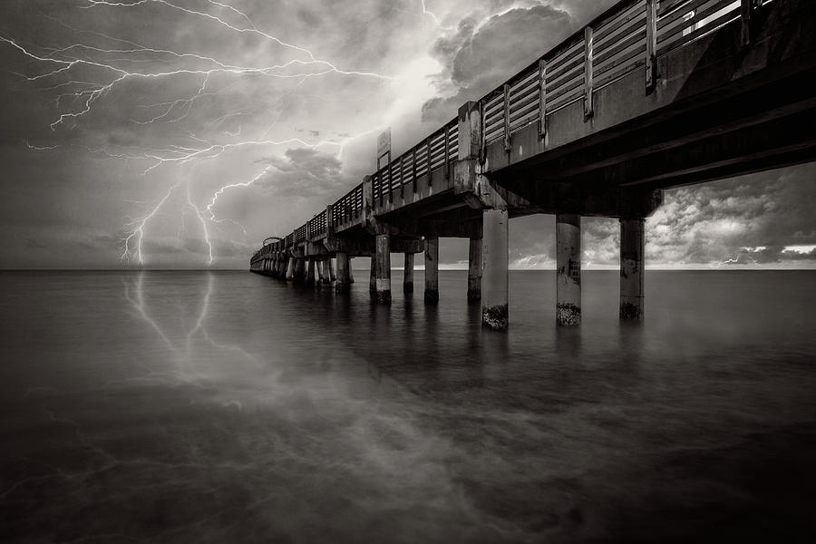 Lightning at the Pier in Black and White Photograph by Debra and Dave Vanderlaan