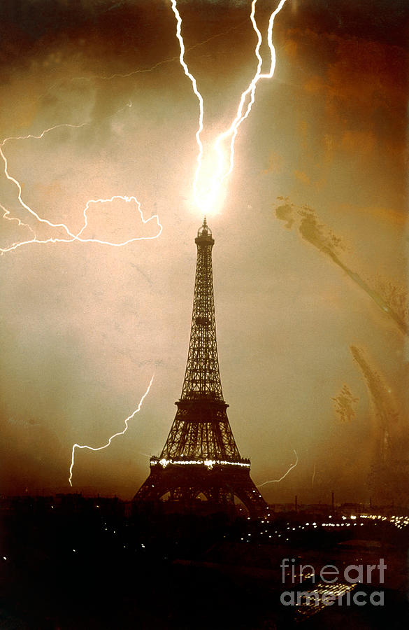 Lightning bolts striking the Eiffel Tower Photograph by JL Charmet