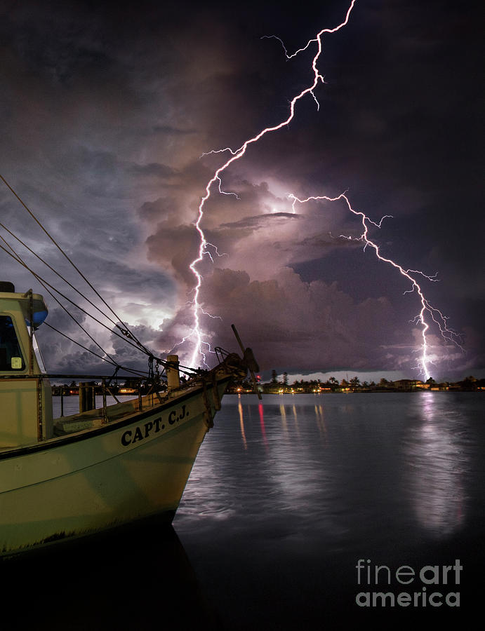 Lightning on the Capt. CJ Photograph by Jon Neidert