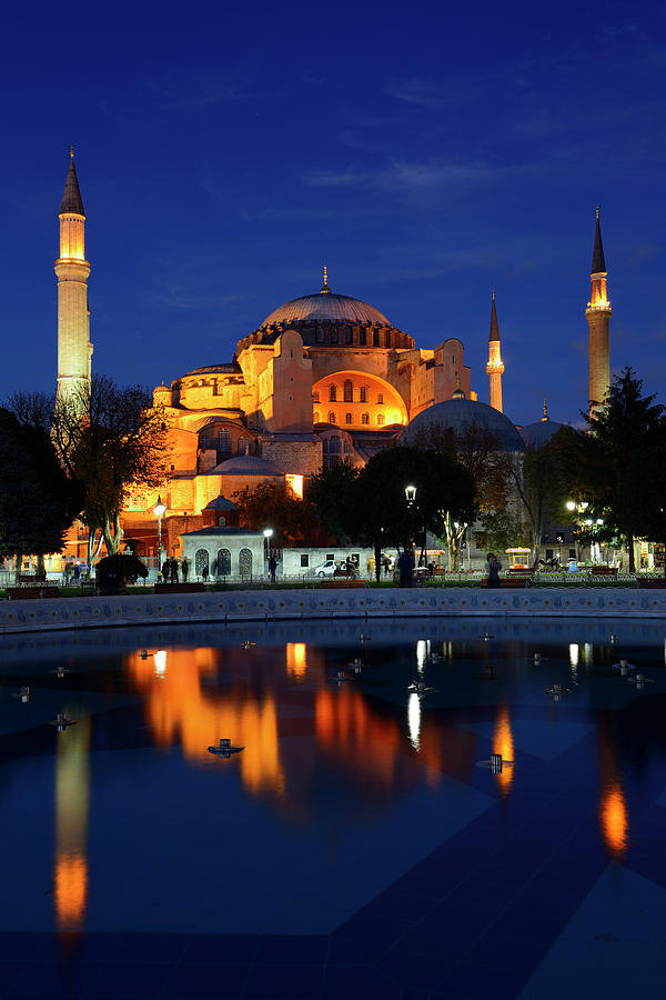 Lights on Hagia Sophia at dusk with reflections in fountain Ista Photograph by Reimar Gaertner