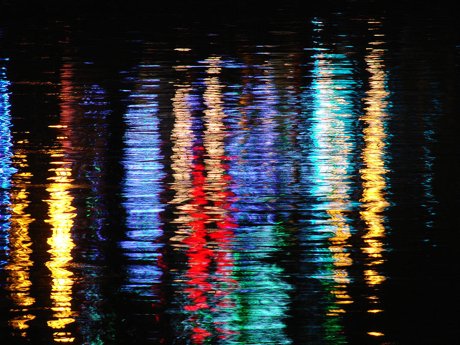 Lights reflecting rippled water surface by Alberto Bizzini - Fine Art