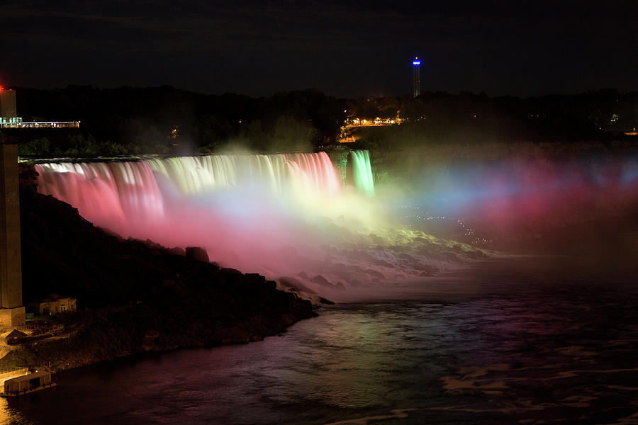 Lights shining on the American Niagara Falls Photograph by Jeff Folger