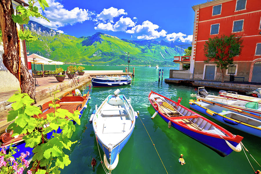 Limone sul Garda turquoise waterfront and boats view Photograph by Brch Photography