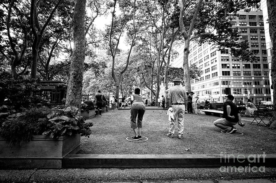 Lining Up the Petanque Shot in New York City Photograph by John Rizzuto