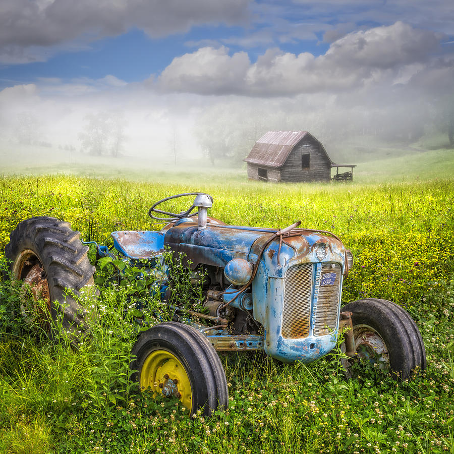 Barn Photograph - Little Blue Tractor by Debra and Dave Vanderlaan