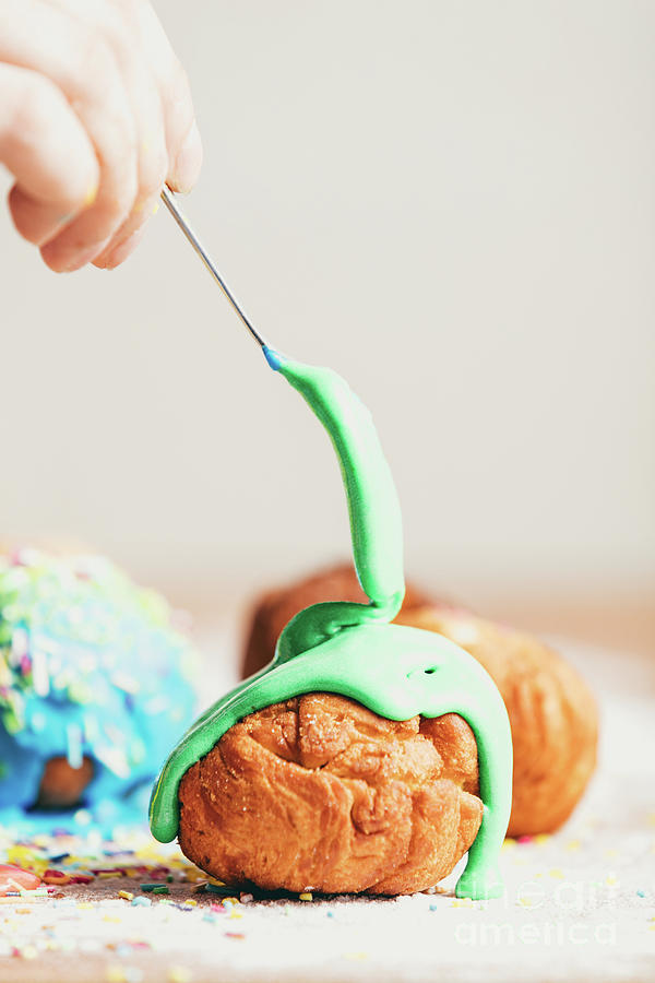 Little doughnut with pastel green frosting Photograph by Michal Bednarek