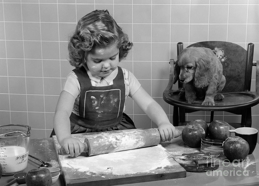 Little Girl Baking As Puppy Looks On Photograph by H. Armstrong Roberts/ClassicStock