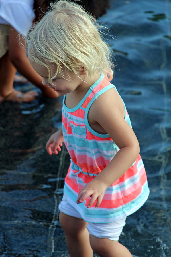 Little Girl Playing In Water Photograph by Cora Wandel
