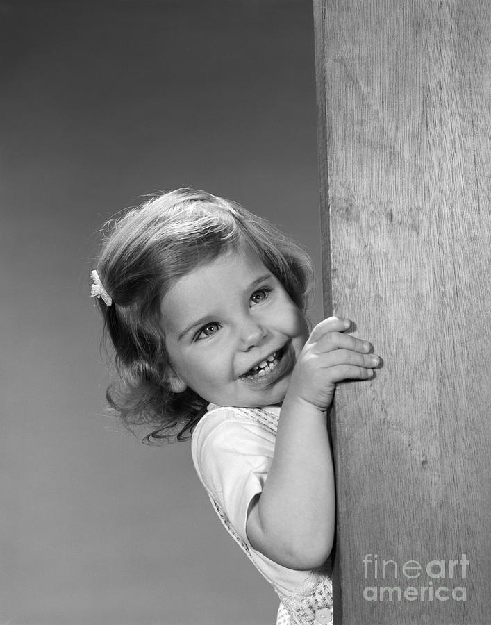 Little Girl Peeking Around Corner Photograph by H. Armstrong Roberts/ClassicStock