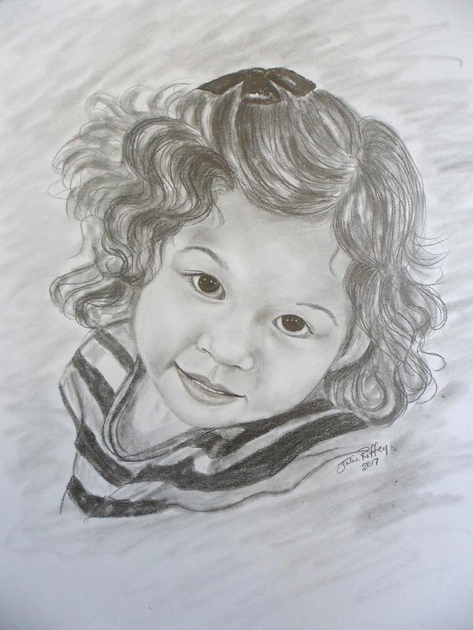 little girl with curly hair drawing