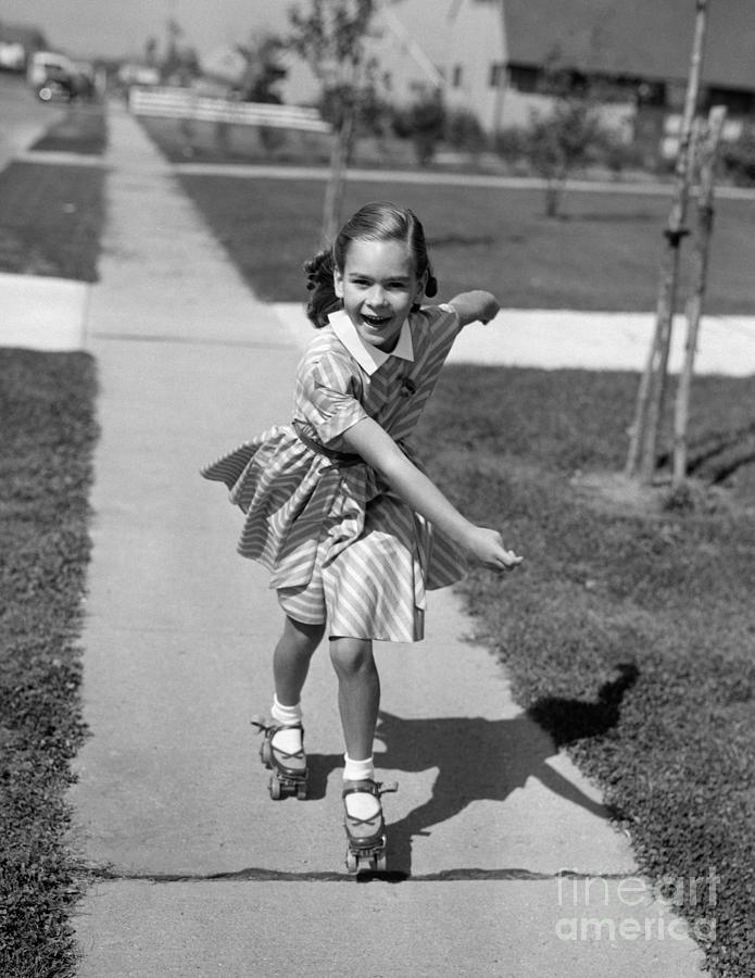 Little Girl Roller-skating On Sidewalk Photograph by Debrocke/ClassicStock