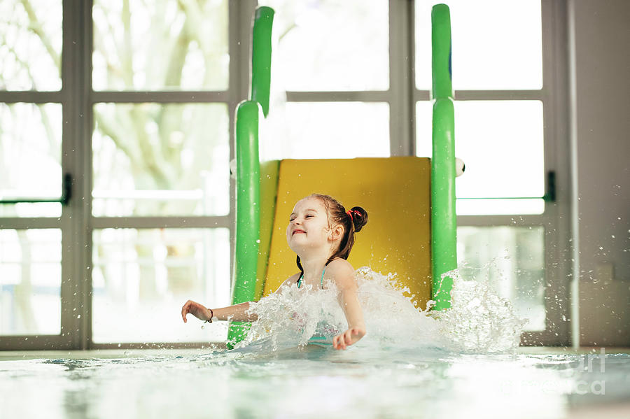 Little girl sliding down the water slide Photograph by Michal Bednarek