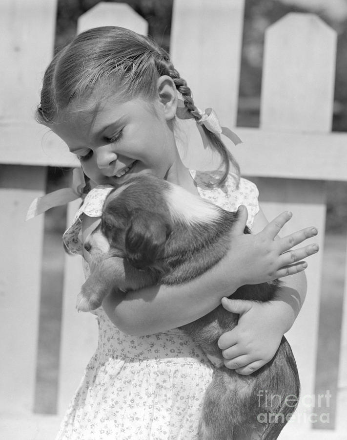 Animal Photograph - Little Girl With Puppy, C. 1930s-50s by Pound/ClassicStock
