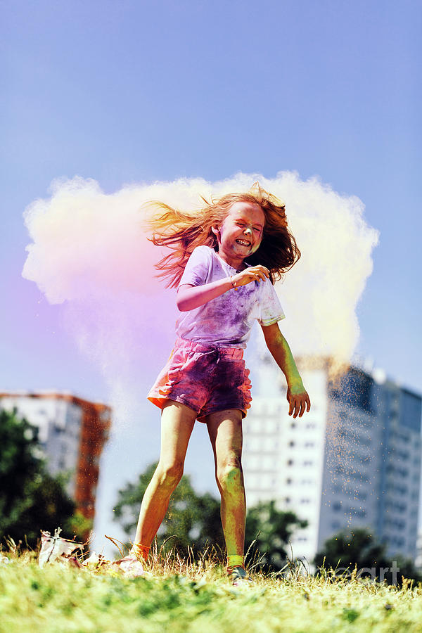 Little happy girl playing with colorful holi powder Photograph by Michal Bednarek