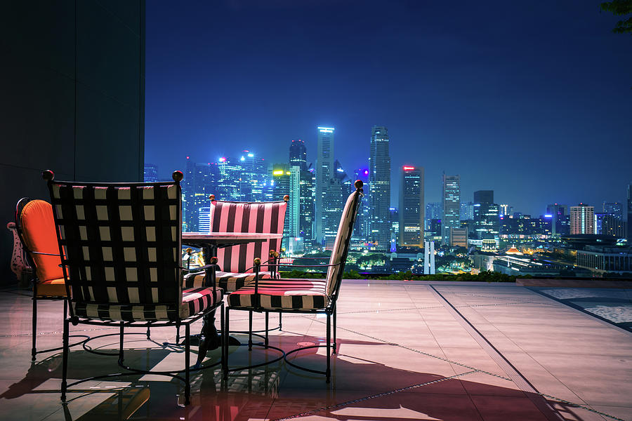 Living room and relax corner on roof top of hotel in Singapore Photograph by Anek Suwannaphoom