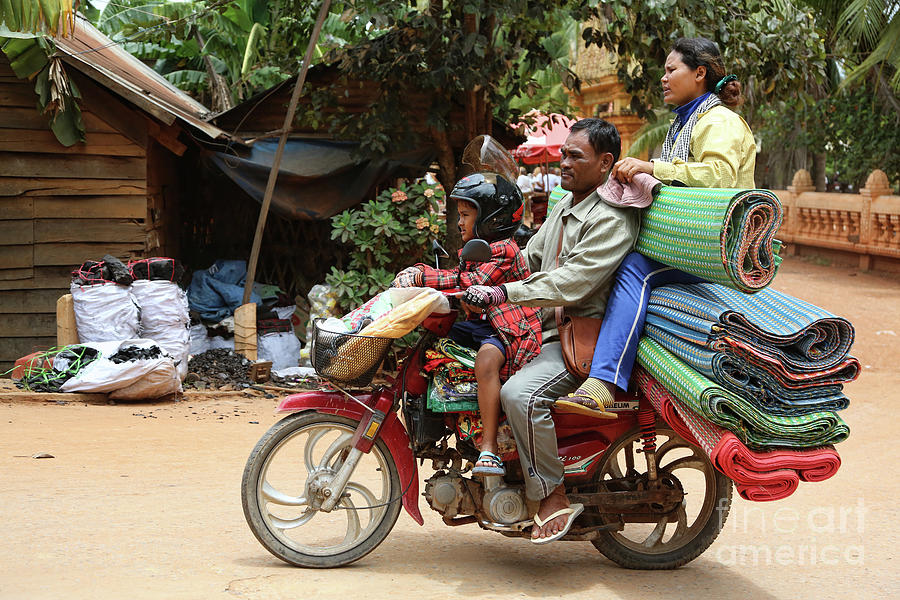 Landscape Photograph - Cambodian Family on Scooter loaded up by Chuck Kuhn