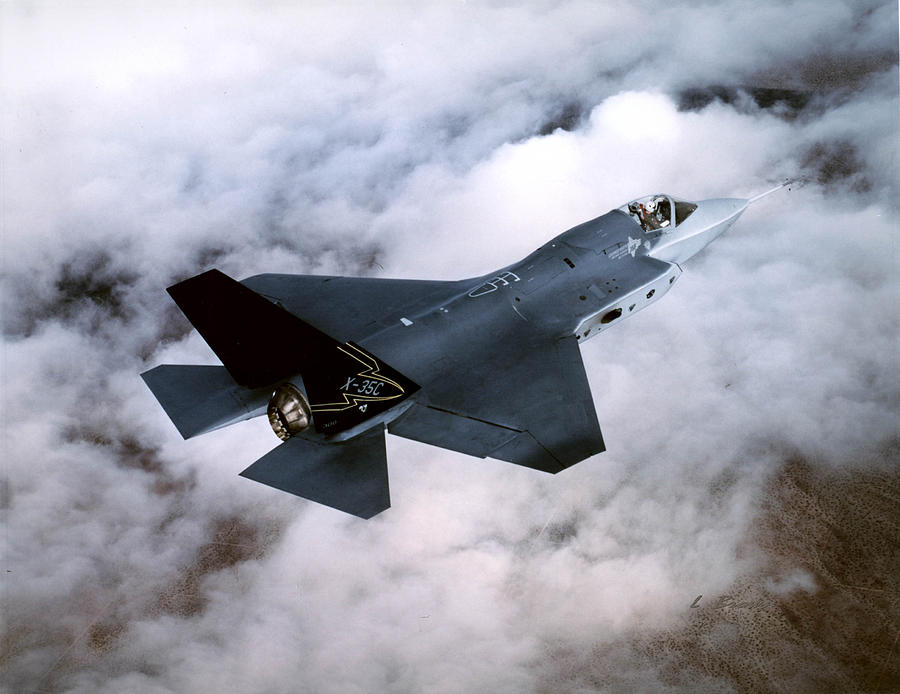 Lockheed Martin F-35 Lightening II Joint Strike Fighter Above The Clouds Photograph by L Brown