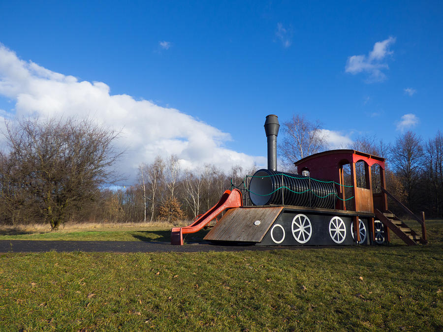 Locomotive on playground Photograph by Miroslav Nemecek