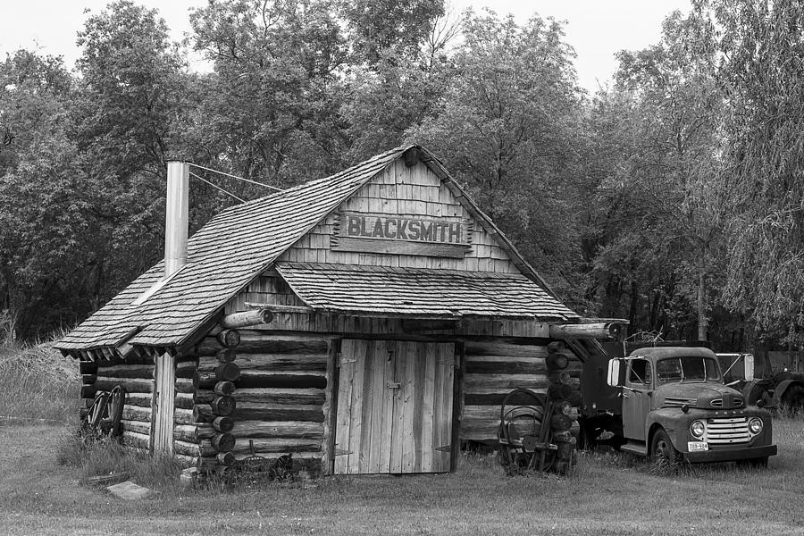 Tree Photograph - Log Building Blacksmith Shop Black and White by Donald  Erickson