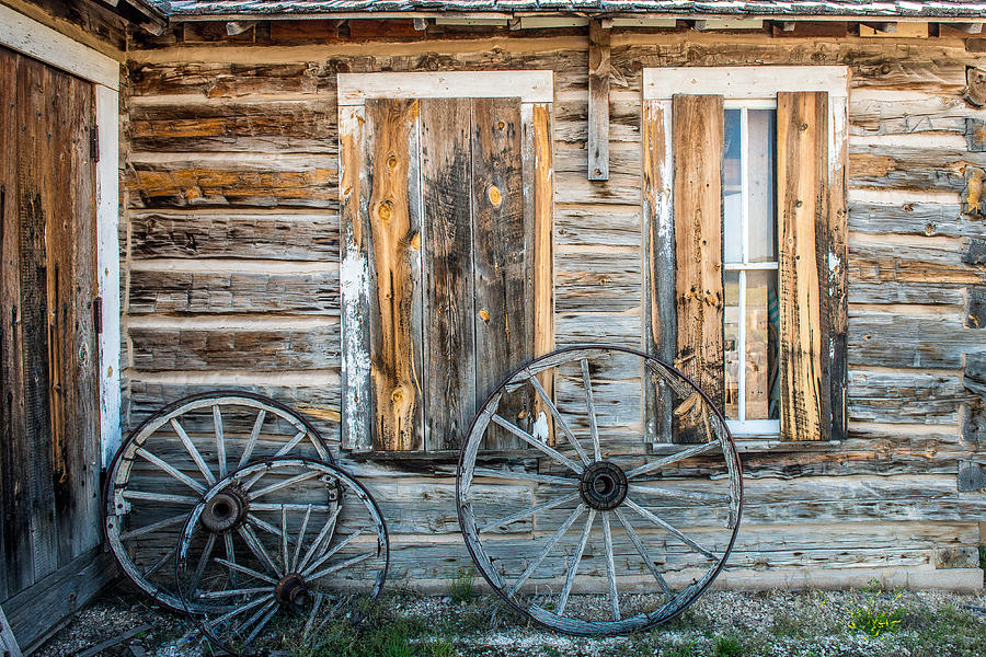 Log Cabin And Wagon Wheels Photograph By Paul Freidlund - Pixels