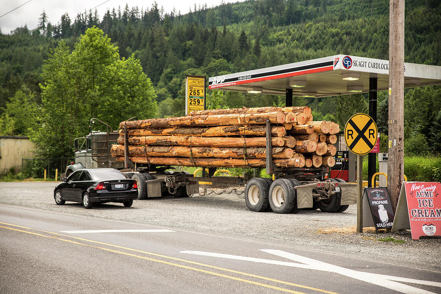 Log Truck in Acme Photograph by Tom Cochran