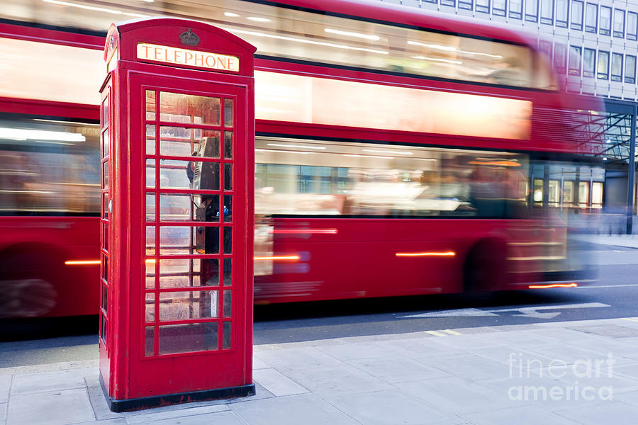 London, UK. Red telephone booth and red bus passing. Symbols of England Photograph by Michal Bednarek