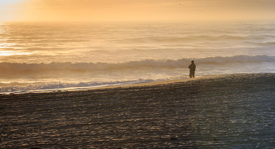Lone fisherman on a misty morning Photograph by Kyle Lee