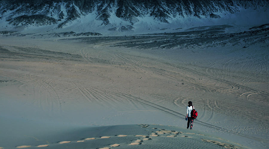 Nature Photograph - Lone girl walking in the dessert by Lunci Hua