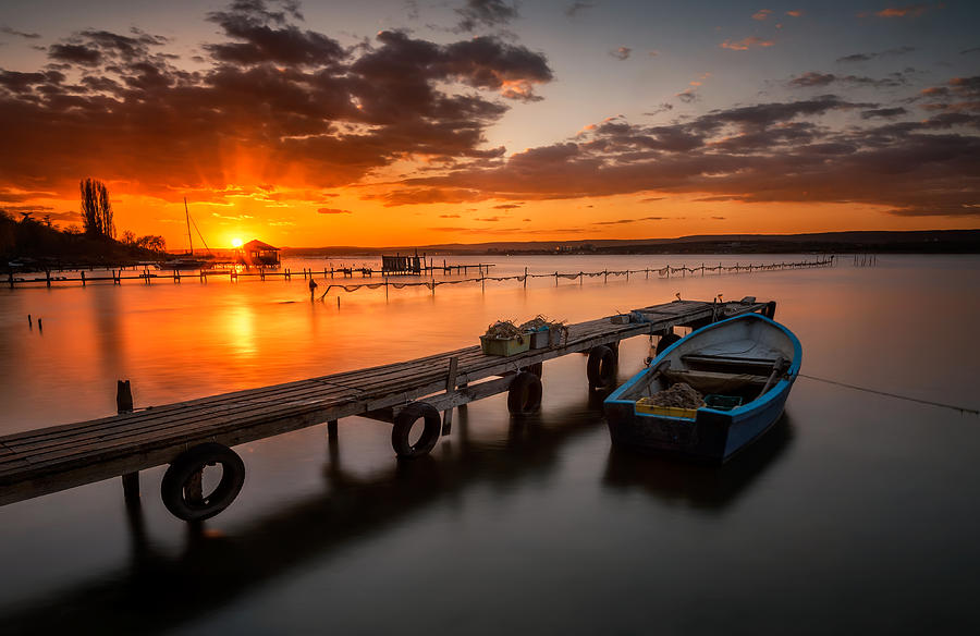 Lonely Boat At Sunset Photograph